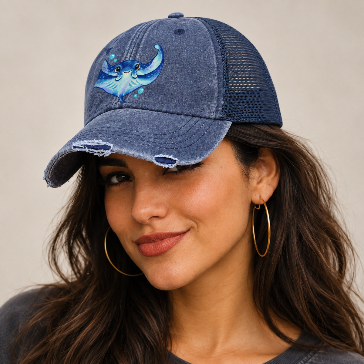 Manta Ray Wing Hug Sea Sprite Washed Trucker Hat — studio model wearing the hat
