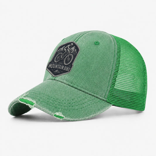 Mountain Bike With Rugged Tires Washed Trucker Hat – Ink Green