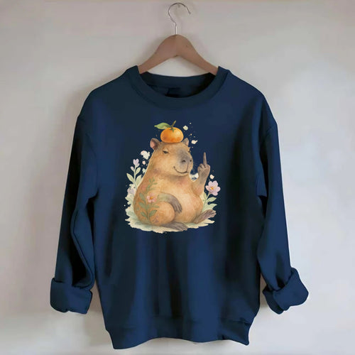 chonky capybara relaxing with orange on head, one webbed middle finger up - Crewneck Sweatshirt