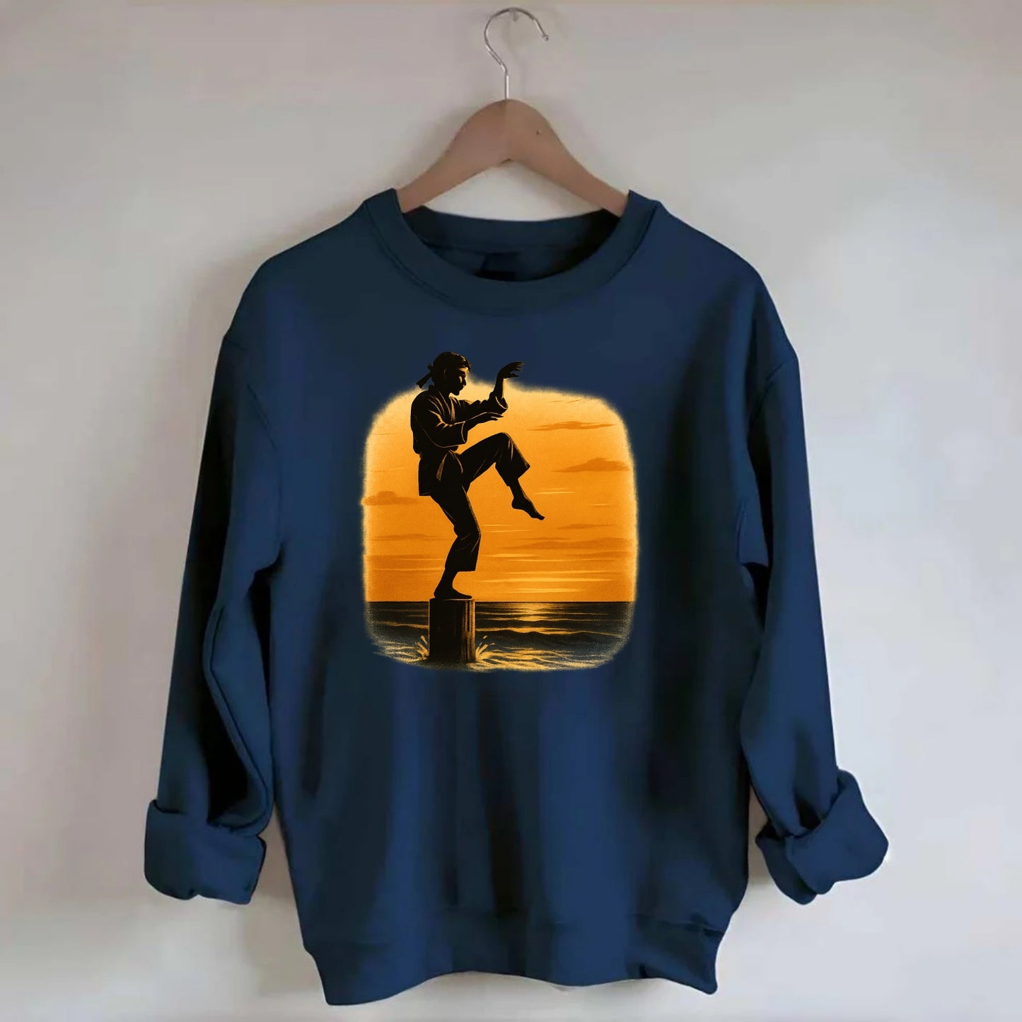 karate crane kick pose on wooden post at beach sunset - Crewneck Sweatshirt - navy