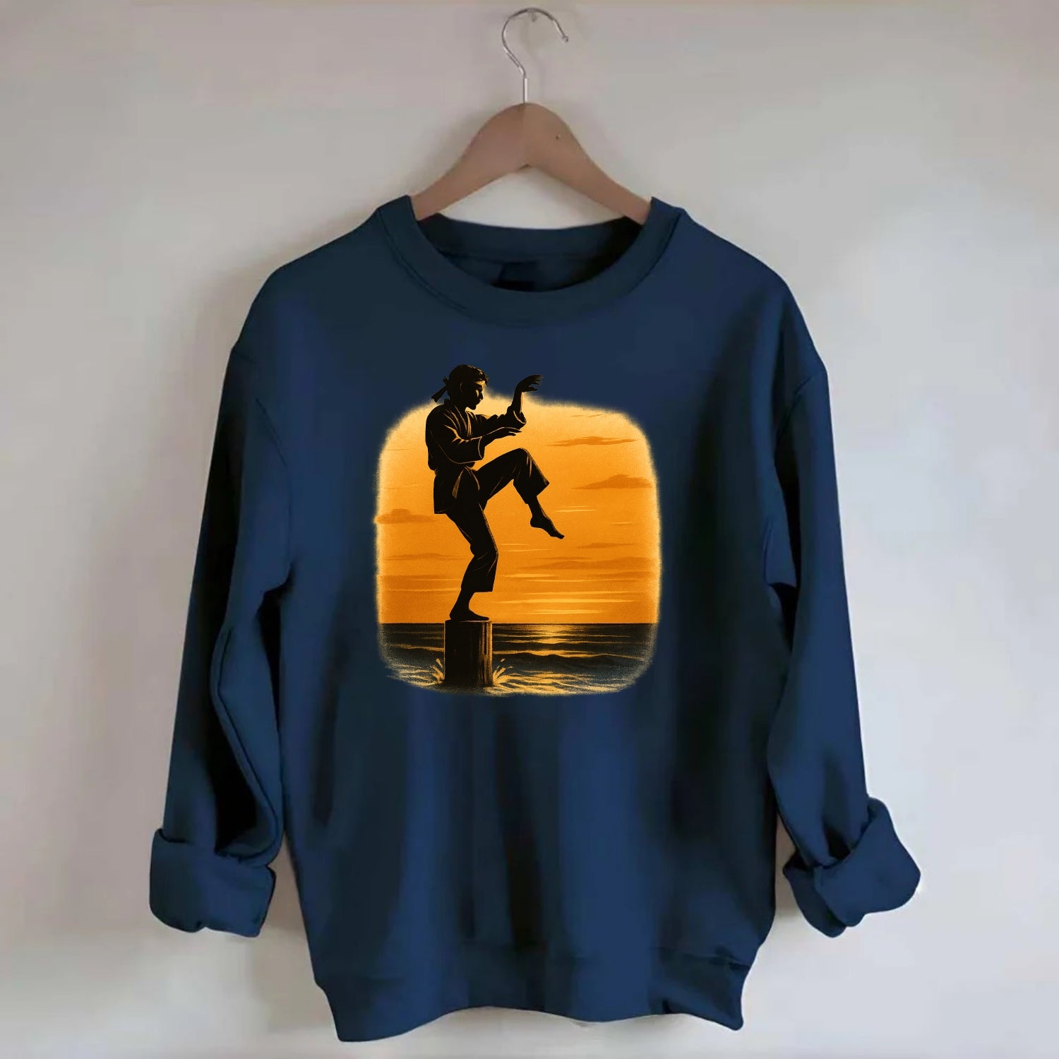 karate crane kick pose on wooden post at beach sunset - Crewneck Sweatshirt - navy