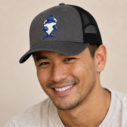 Orca Front Splash Sea Sprite Trucker Hat — studio model wearing the hat