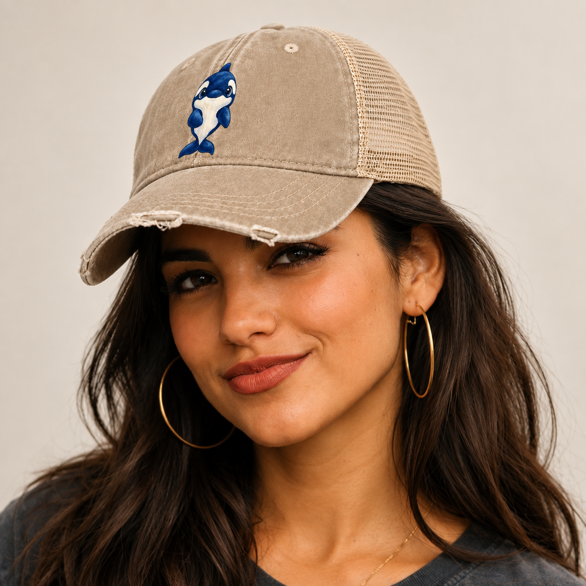 Orca Front Splash Sea Sprite Washed Trucker Hat — studio model wearing the hat
