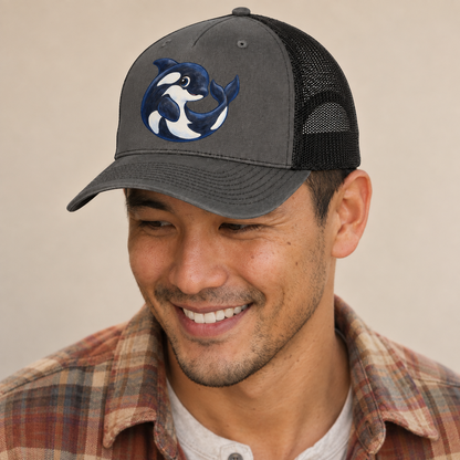 Orca Moon Curl Sea Sprite Trucker Hat — studio model wearing the hat