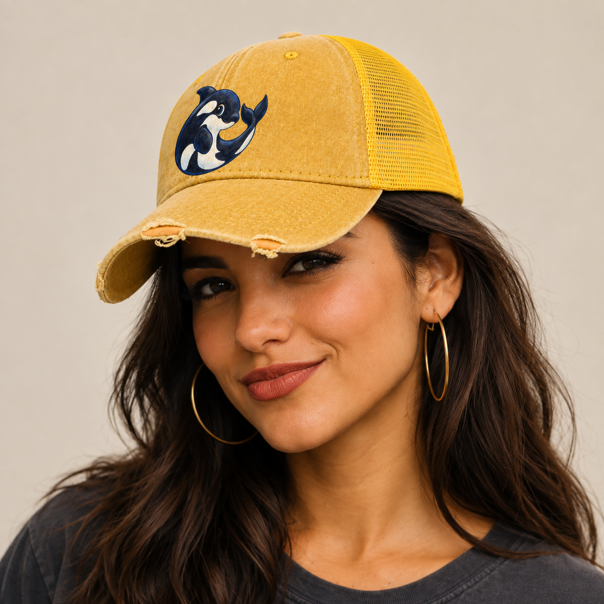 Orca Moon Curl Sea Sprite Washed Trucker Hat — studio model wearing the hat