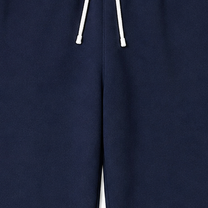 Persian Lion Arch Fleece Sweatpants – navy-blue fabric close-up
