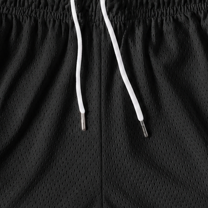 Persian Lion Arch Mesh Shorts – black fabric close-up
