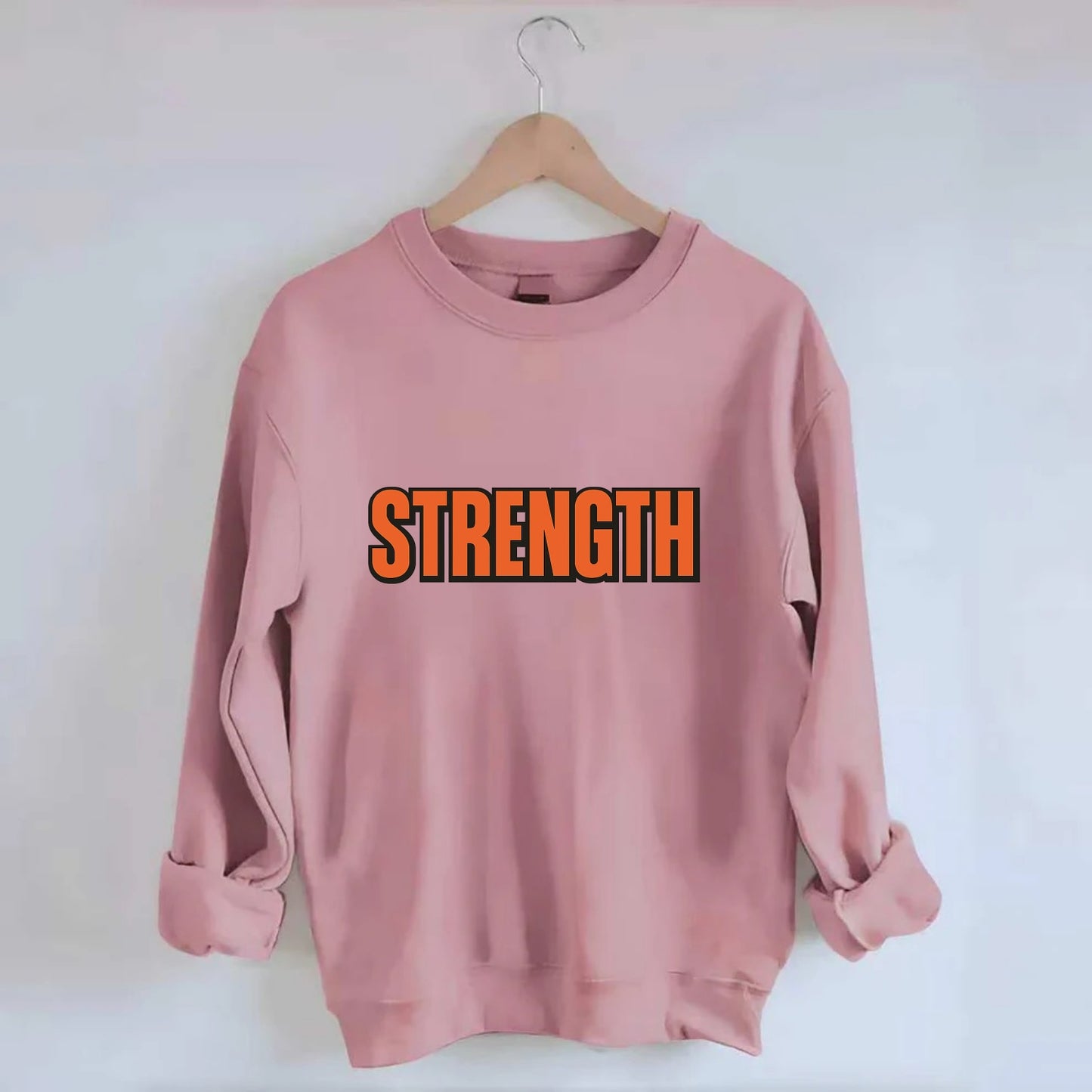 Bold typography design - "STRENGTH" - inner power, resilience, fortitude - Crewneck Sweatshirt - pink