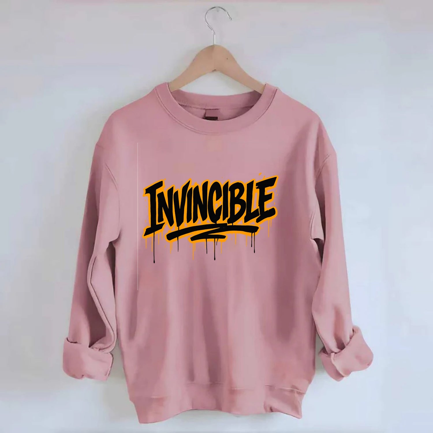 Bold typography design - "INVINCIBLE" - cannot be defeated, unconquerable - Crewneck Sweatshirt - pink
