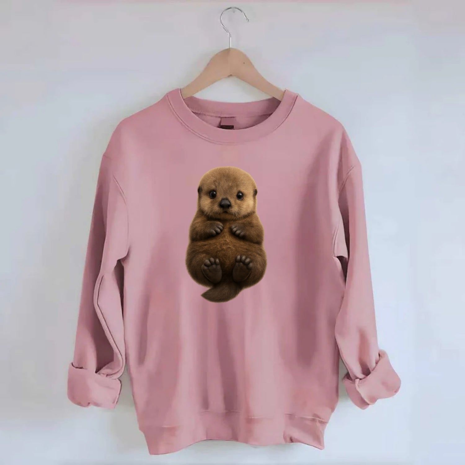 Baby Sea Otter - brown fluffy, floating on back, tiny paws, bright eyes, - Crewneck Sweatshirt - pink