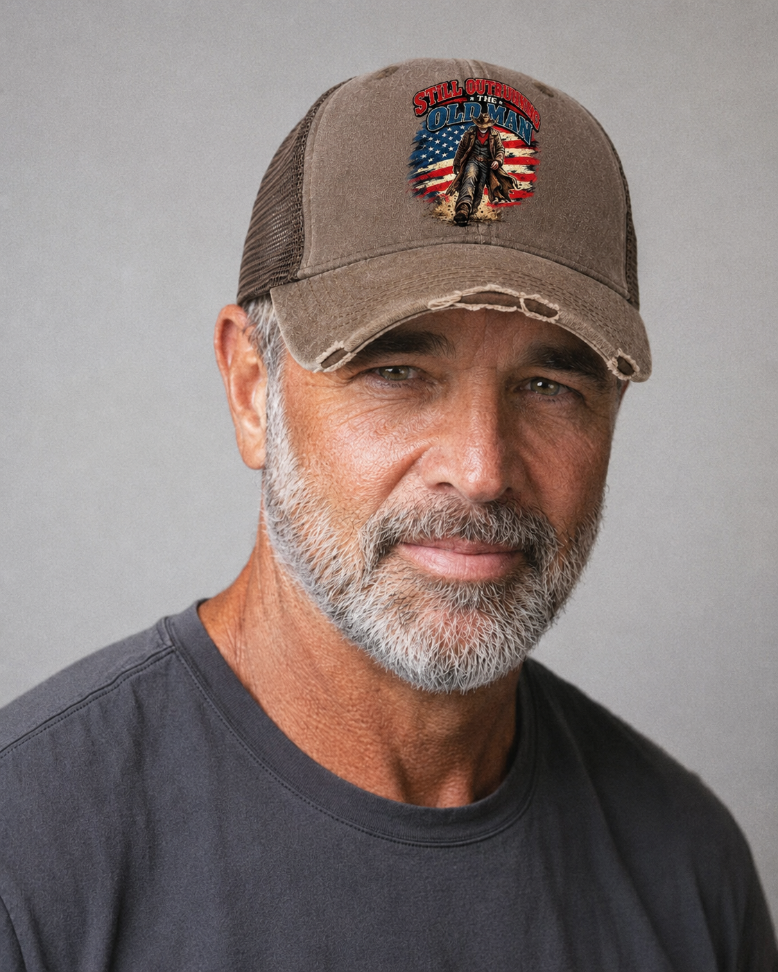 Still Outrunning The Old Man Old Man Strong Washed Trucker Hat – studio model photo