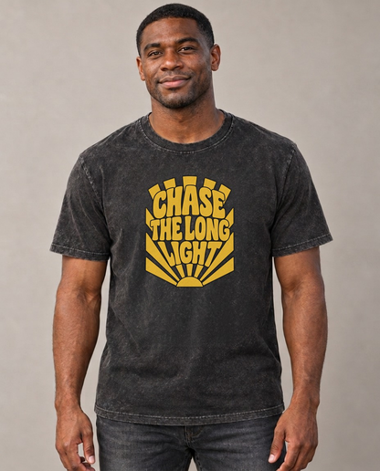 Chase The Long Light Sunburst Sayings Vintage T-shirt – black, small print on model (AI mockup)