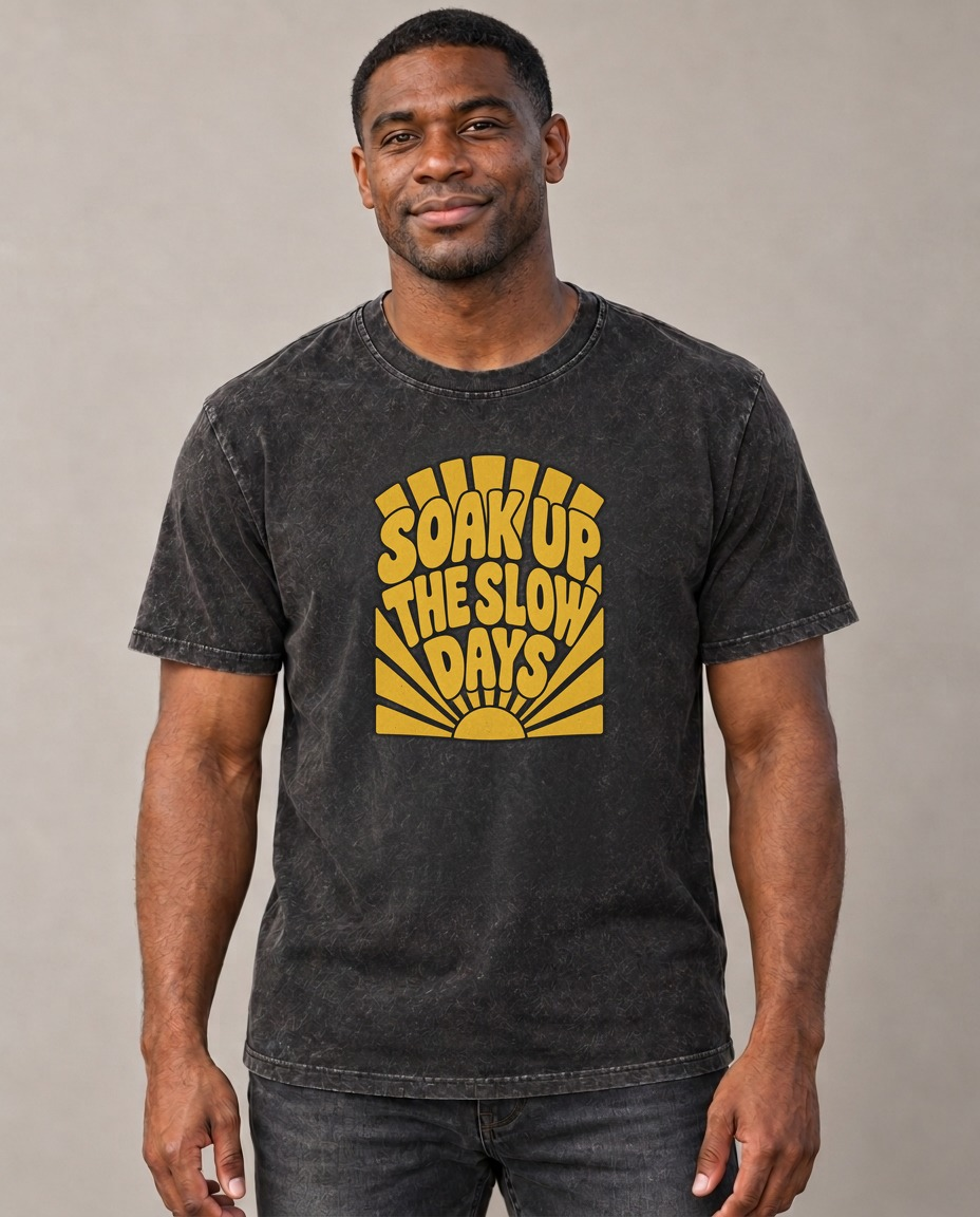 Soak Up The Slow Days Sunburst Sayings Vintage T-shirt – black, small print on model (AI mockup)