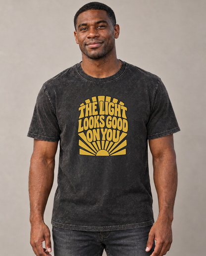 The Light Looks Good On You Sunburst Sayings Vintage T-shirt – black, small print on model (AI mockup)