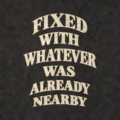 Fixed With Whatever Was Already Nearby Quiet Statements Vintage T-shirt – black, print and cotton detail (AI mockup)
