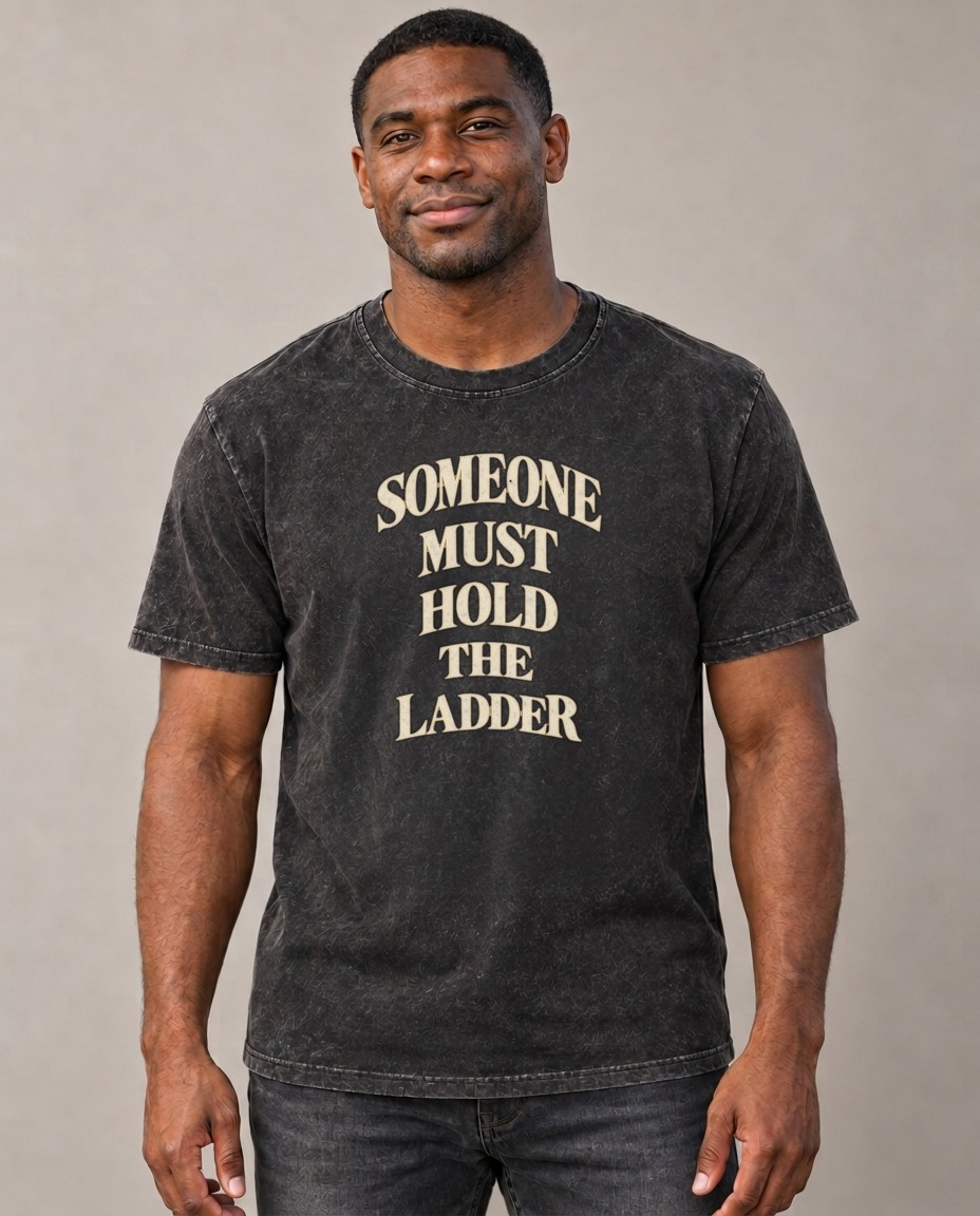 Someone Must Hold The Ladder Quiet Statements Vintage T-shirt – black, small print on model (AI mockup)
