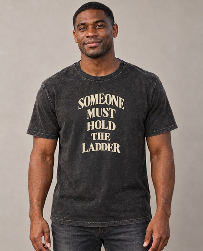 Someone Must Hold The Ladder Quiet Statements Vintage T-shirt – black, small print on model (AI mockup)