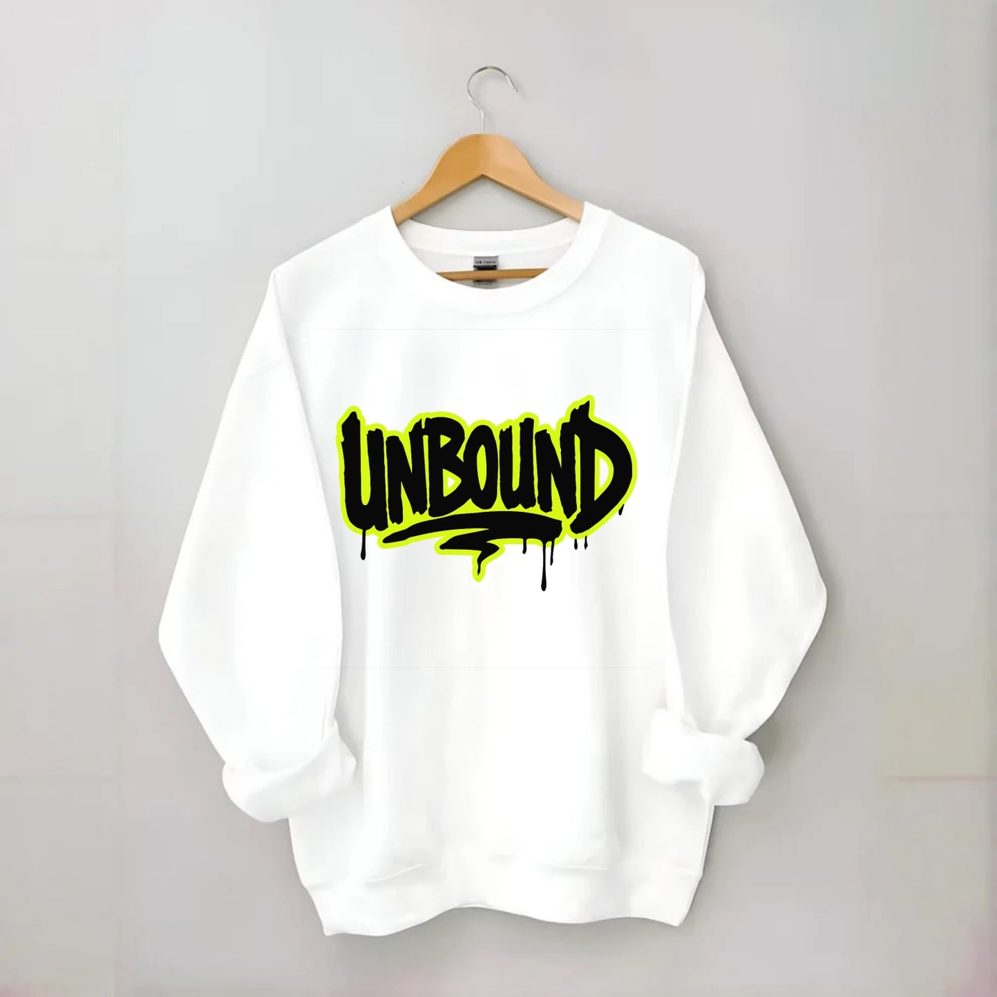 Bold typography design - "UNBOUND" - without limits, free from constraints - Crewneck Sweatshirt - white