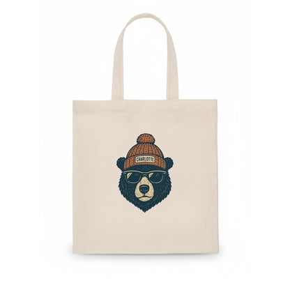North Carolina Black Bear wearing Charlotte beanie with pom pom and wayfarer sunglasses - Tote Bag - white