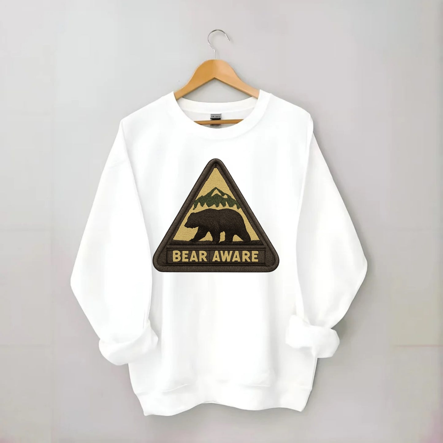 BEAR AWARE - bear silhouette warning in brown and yellow , wilderness safety - Crewneck Sweatshirt - white