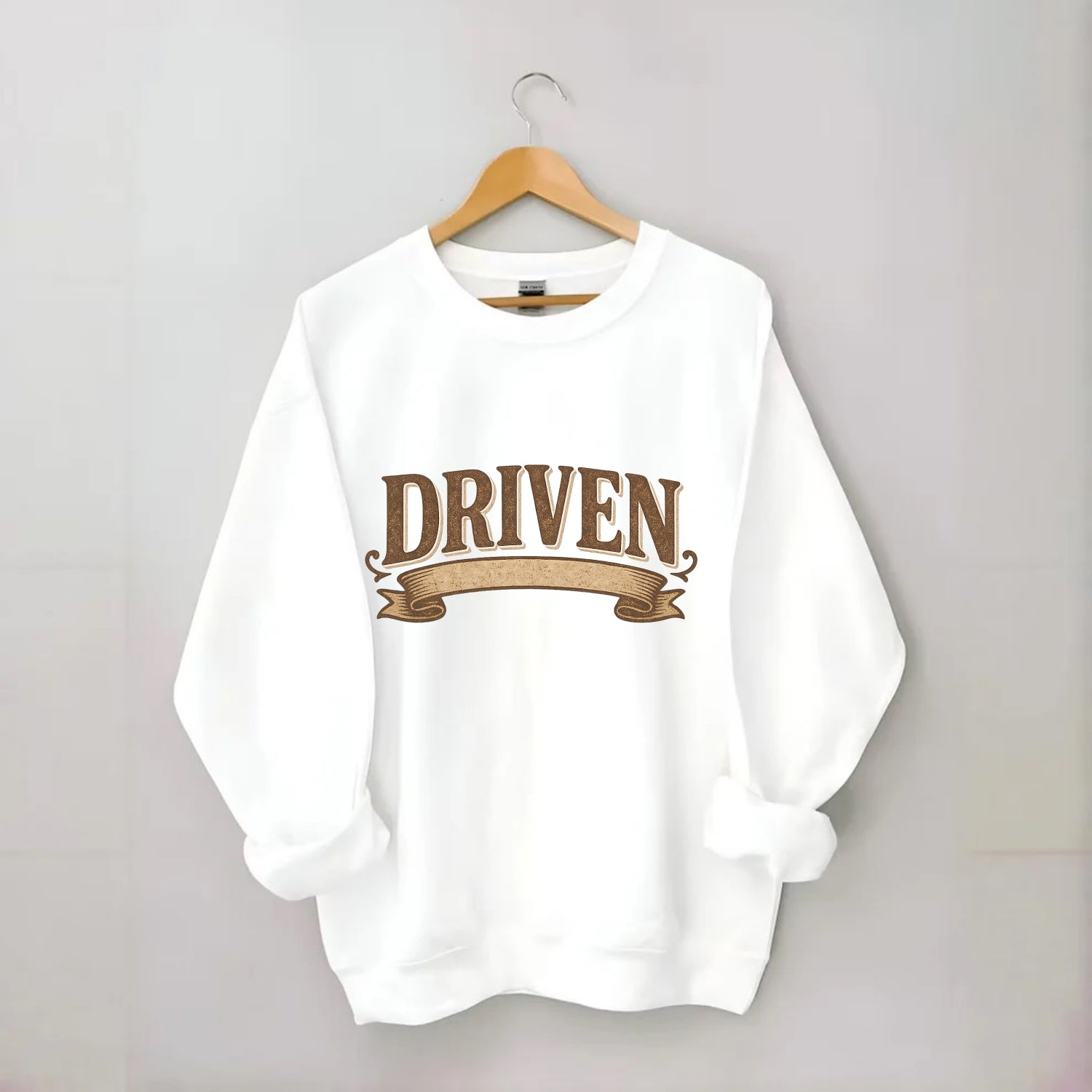 Bold typography design - "DRIVEN" - motivated, focused on goals - Crewneck Sweatshirt - white