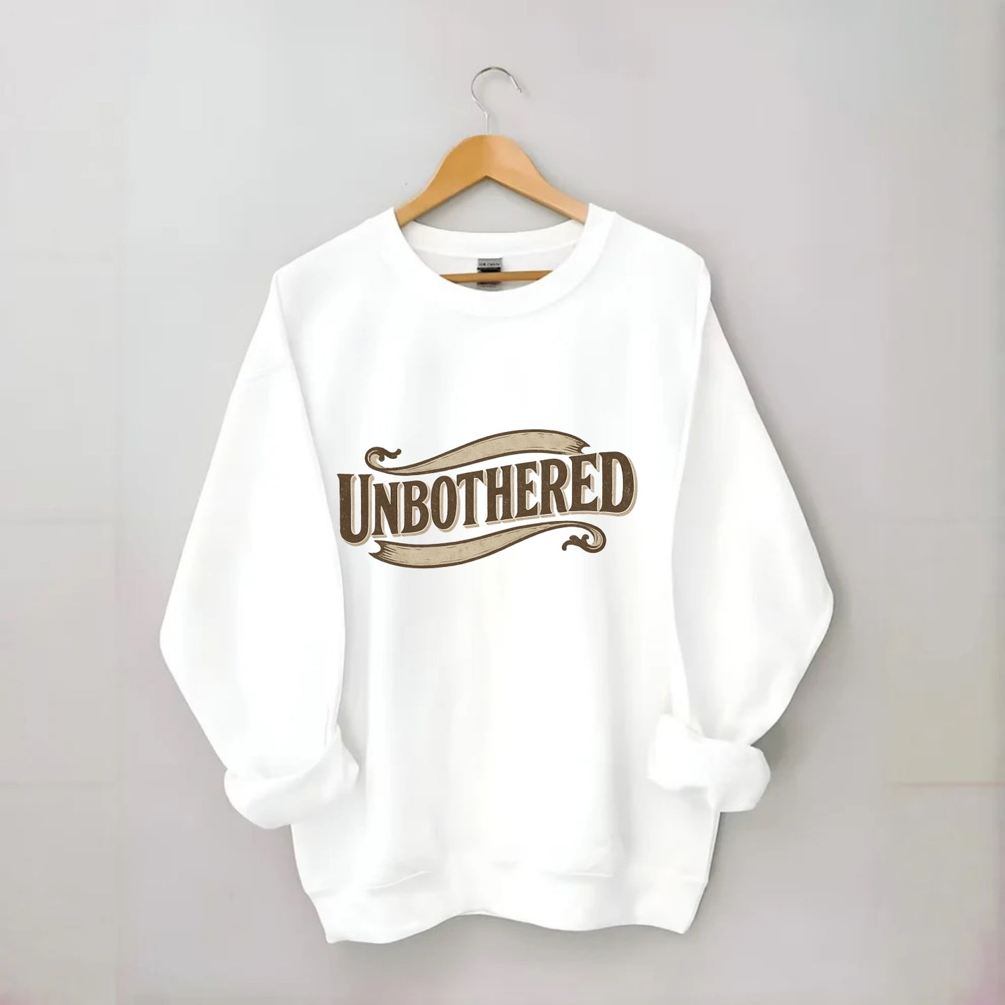 Bold typography design - "UNBOTHERED" - not affected, staying calm - Crewneck Sweatshirt - white