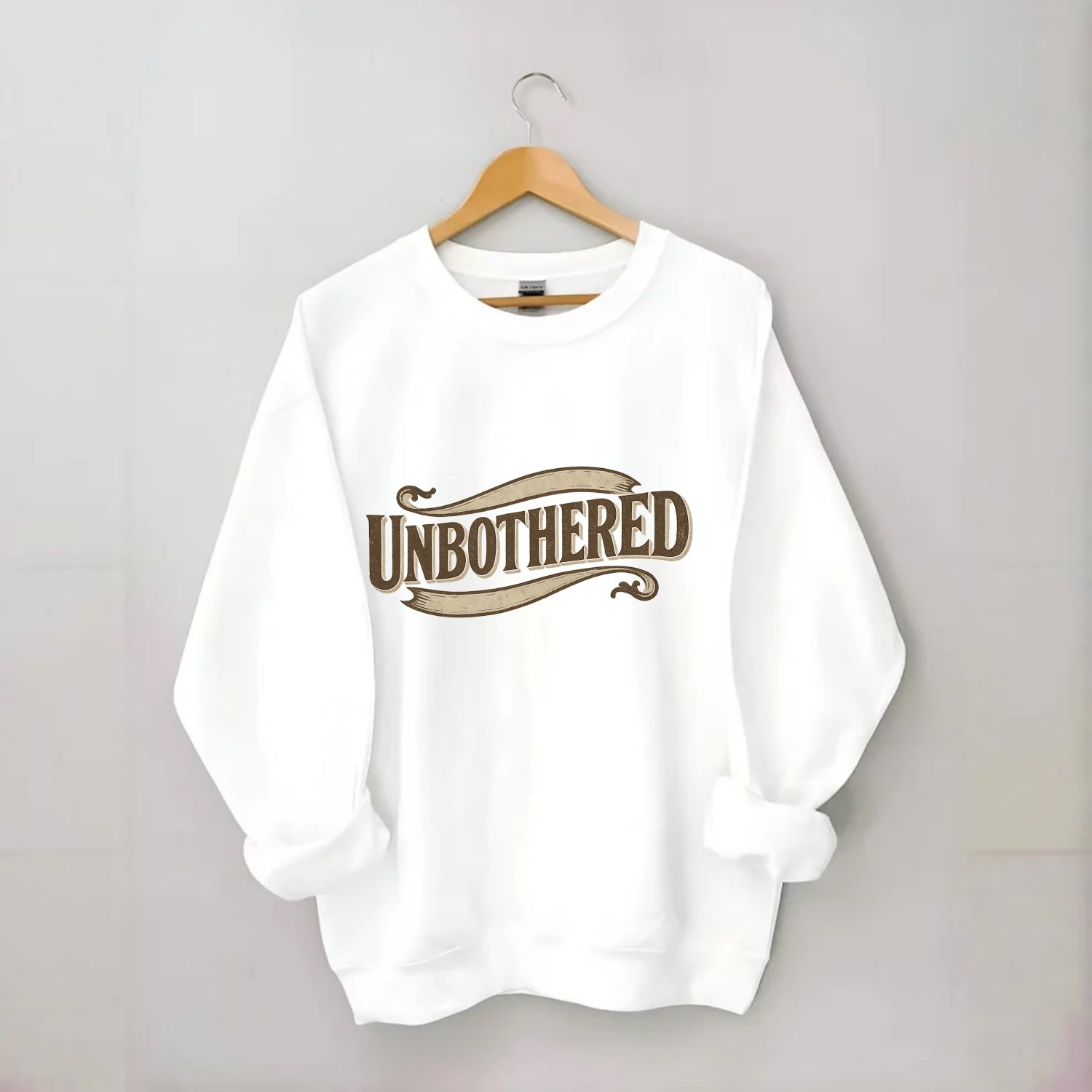 Bold typography design - "UNBOTHERED" - not affected, staying calm - Crewneck Sweatshirt - white