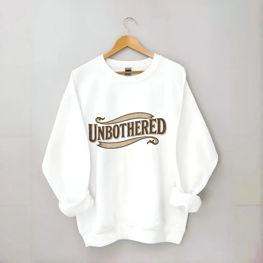 Bold typography design - "UNBOTHERED" - not affected, staying calm - Crewneck Sweatshirt - white