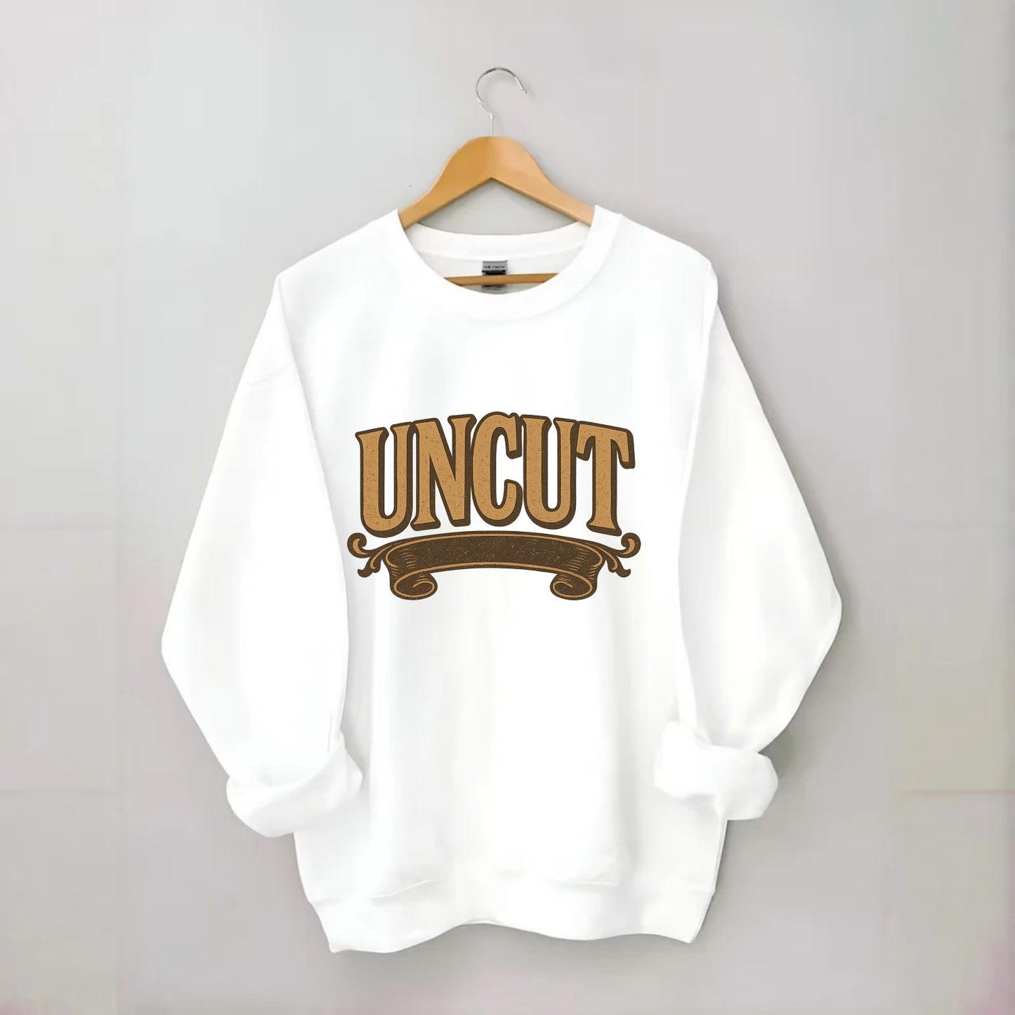 Bold typography design - "UNCUT" - pure, undiluted, authentic - Crewneck Sweatshirt - white