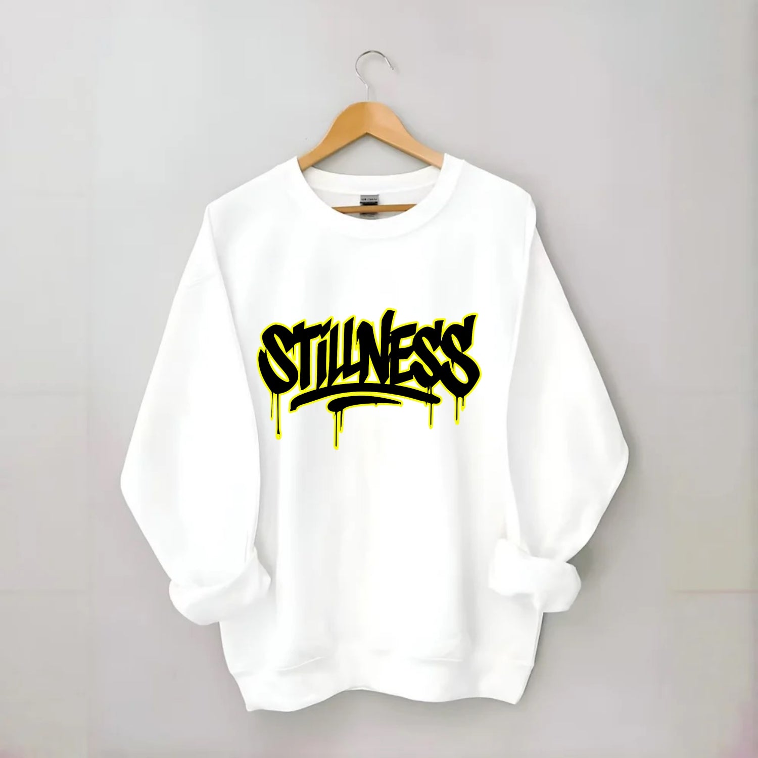 Bold typography design - "STILLNESS" - quiet power, peaceful presence - Crewneck Sweatshirt - white
