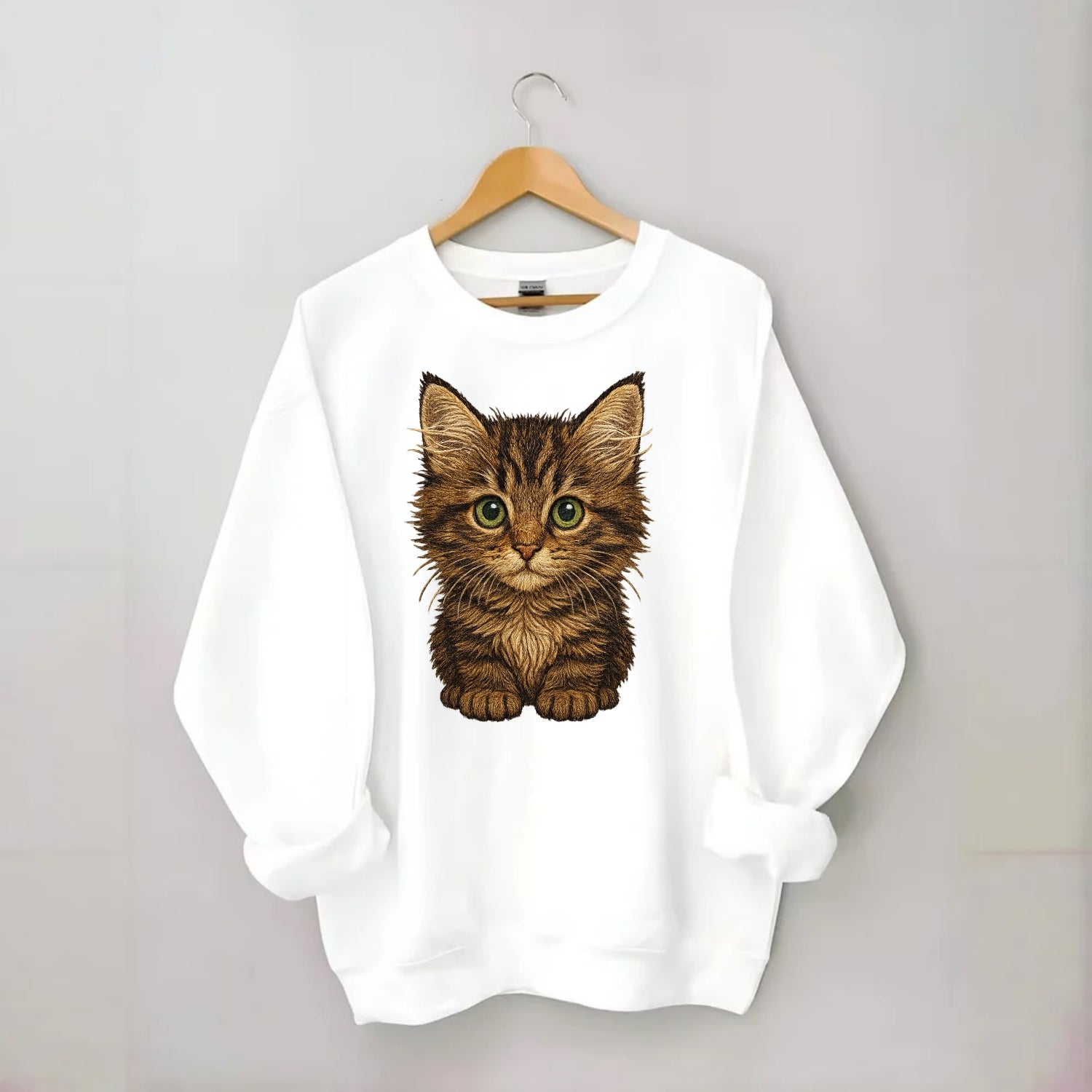 Baby Maine Coon Kitten - large fluffy tabby, tufted ears, big green eyes, - Crewneck Sweatshirt - white