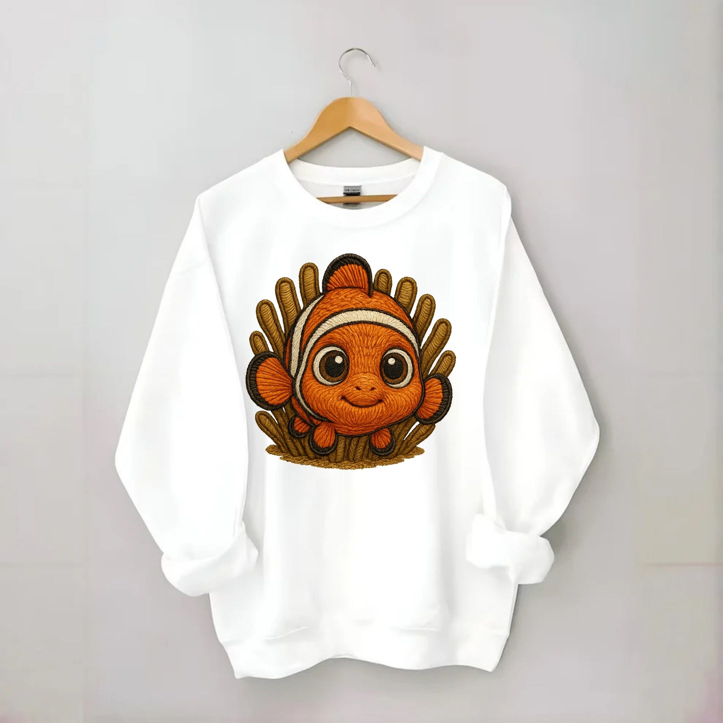 Baby Clownfish - orange with white stripes, big round eyes, front-facing in - Crewneck Sweatshirt - white