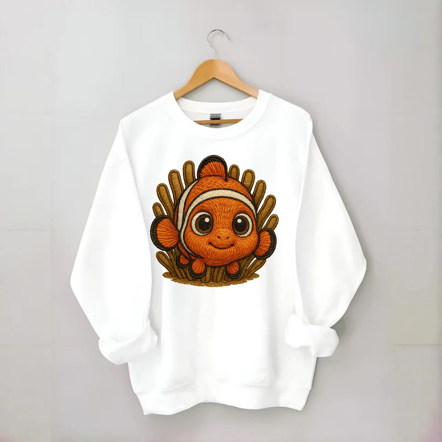 Baby Clownfish - orange with white stripes, big round eyes, front-facing in - Crewneck Sweatshirt - white