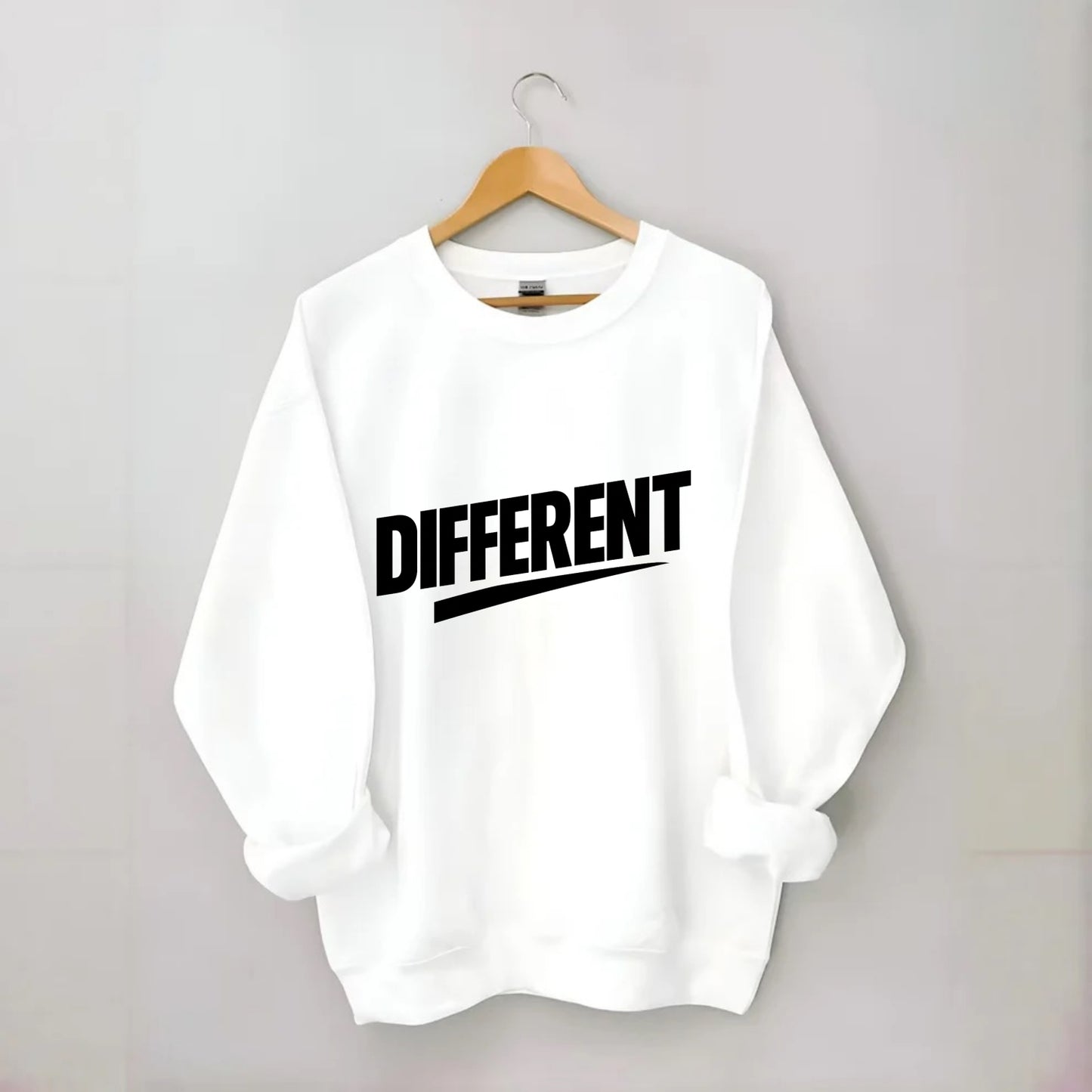 Bold typography design - "DIFFERENT" - standing out, not following crowd - Crewneck Sweatshirt - white