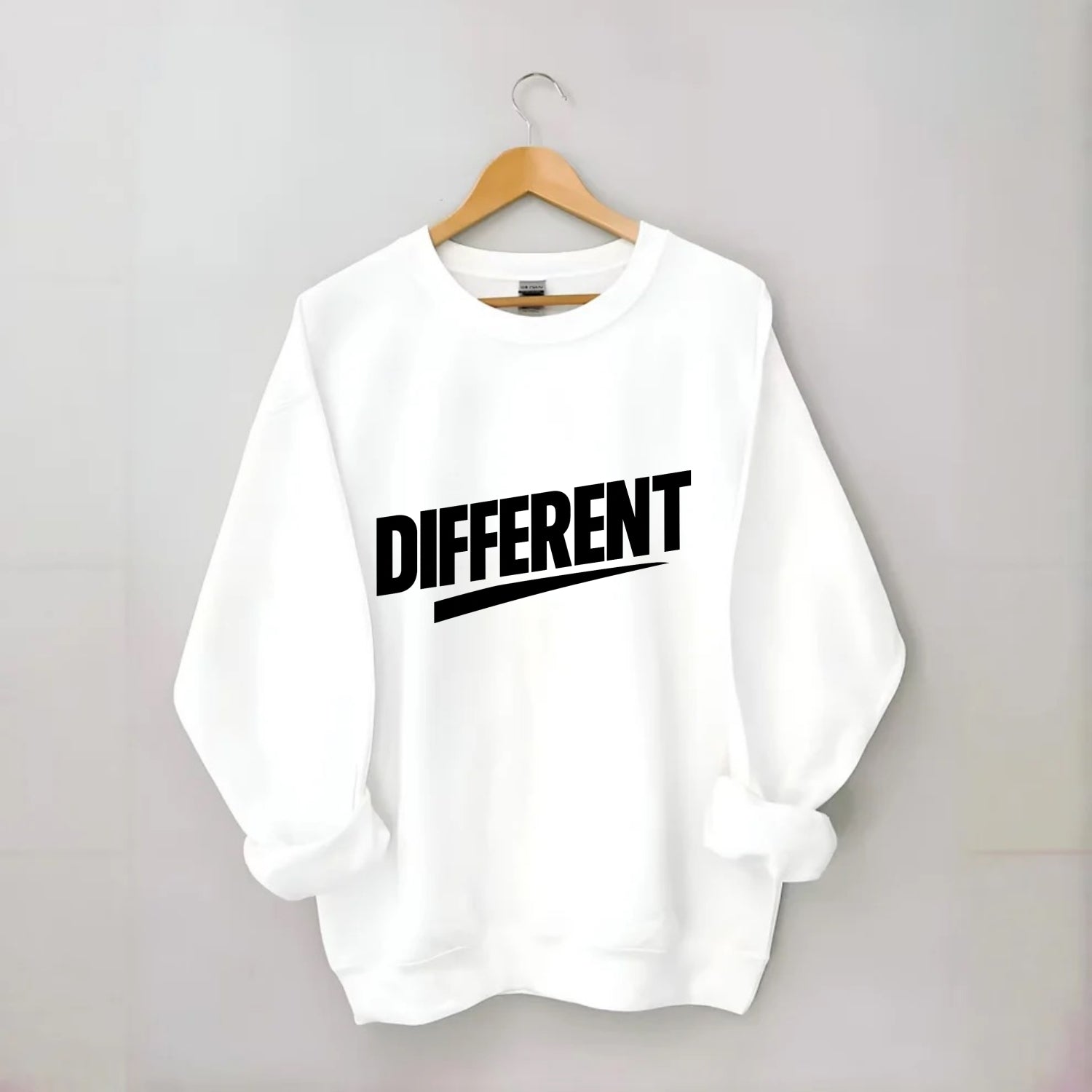 Bold typography design - "DIFFERENT" - standing out, not following crowd - Crewneck Sweatshirt - white