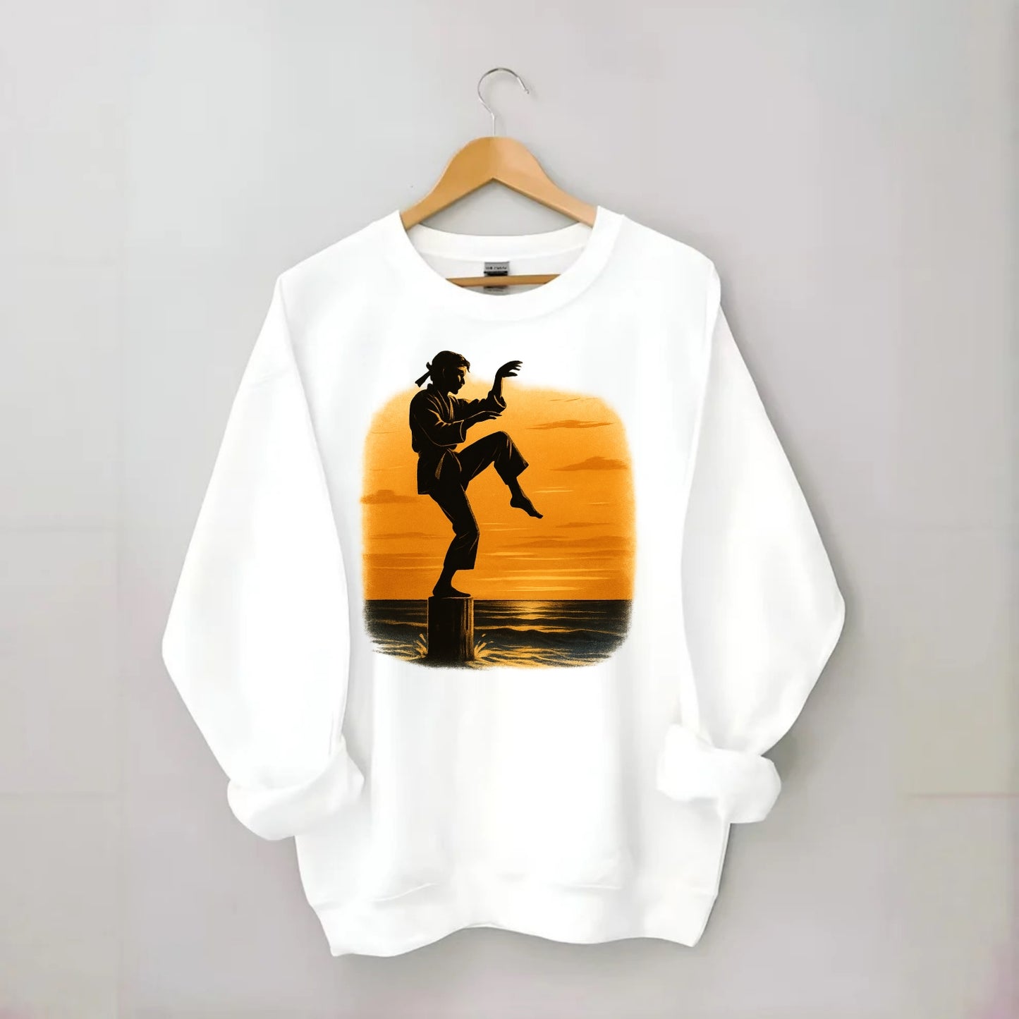 karate crane kick pose on wooden post at beach sunset - Crewneck Sweatshirt - white