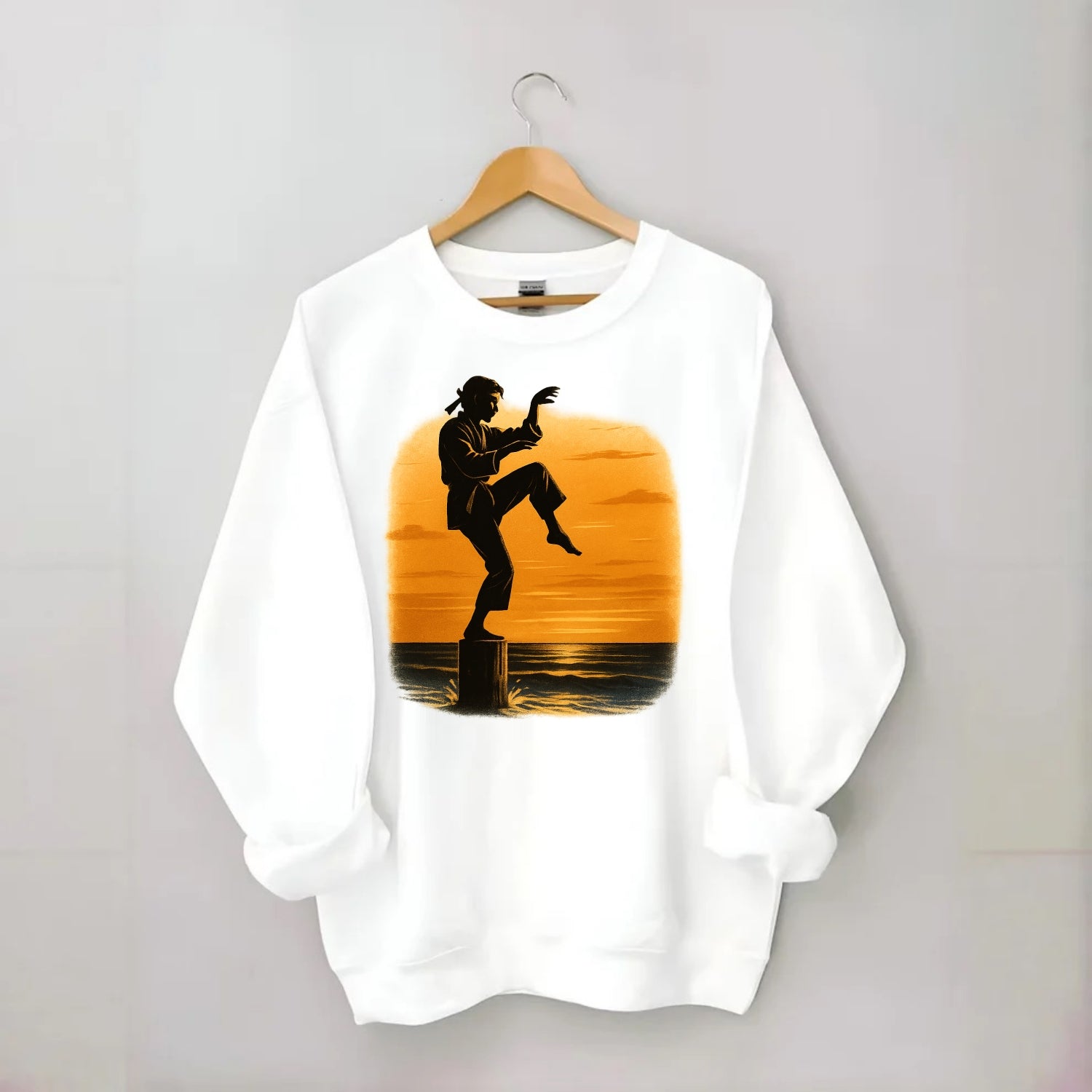 karate crane kick pose on wooden post at beach sunset - Crewneck Sweatshirt - white