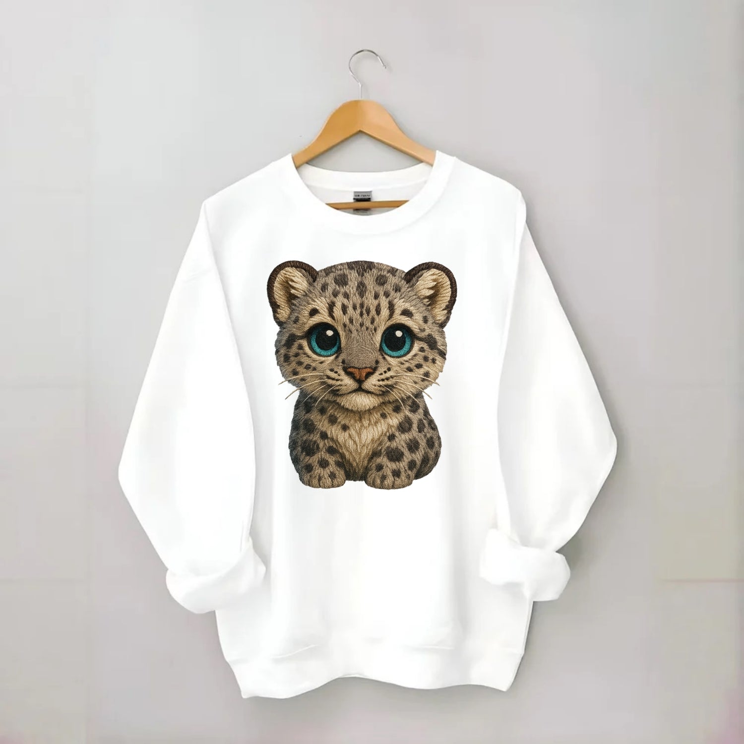 Baby Snow Leopard Cub - gray spotted, thick fur, blue-green eyes, - Crewneck Sweatshirt - white