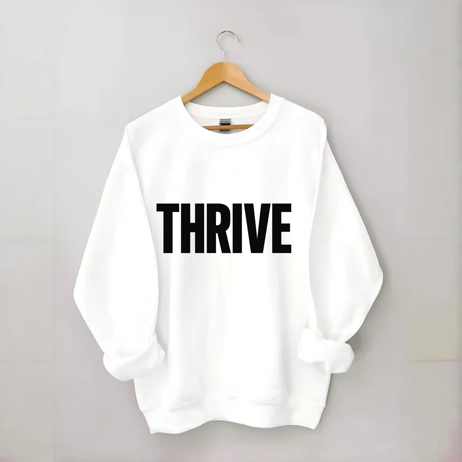 Bold typography design - "THRIVE" - flourishing, doing well - Crewneck Sweatshirt - white